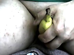 Horny arab girl using a banana up close