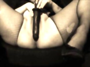 Big woman plays with her big black dildo