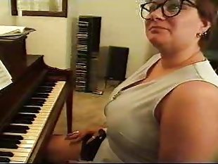 Chubby mature plays piano