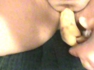Girl fucks her self with banana
